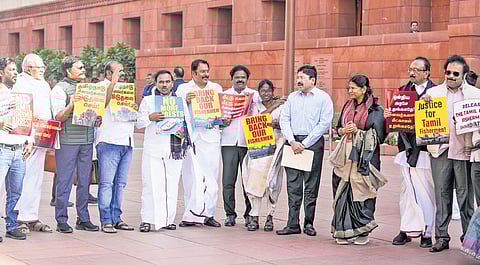 DMK MPs stage a demonstration against the arrest of Indian fishermen by the
Sri Lankan Navy during the Budget session of Parliament on Friday | PTI