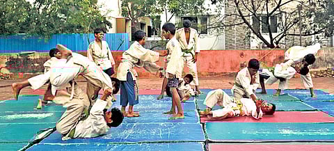 Kids practising judo at a shelter for homeless