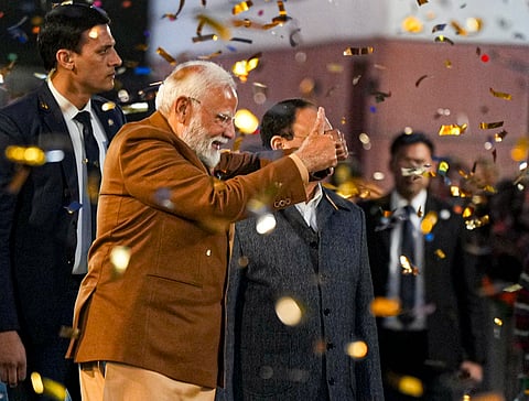 Prime Minister Narendra Modi greets supporters upon his arrival at BJP headquarters, on the day of counting of votes for Delhi Assembly elections, in New Delhi, Saturday, Feb. 8, 2025.