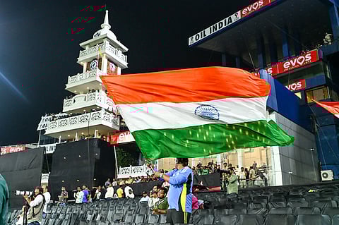 Crowd waving the India flag at the Barabati Stadium