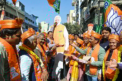 BJP workers celebrate the party's victory in the Delhi Assembly election and UP's Milkipur by-election, in Varanasi, Saturday, Feb. 8, 2025.