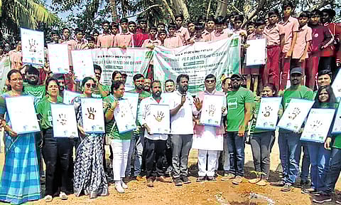 Students and WEO members take part in the environmental awareness programme at the Mahatma Jyotiba Phule Gurukul School in Deshmukh village, Bhoodan Pochampally mandal, Yadadri Bhuvanagiri district, on Saturday