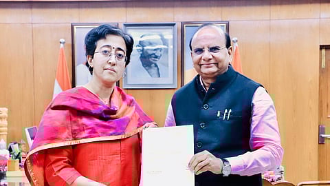 Outgoing Delhi Chief Minister and AAP leader Atishi hands over her resignation letter to Lt. Governor VK Saxena at the Raj Niwas in Delhi on Sunday, Feb. 9, 2025.