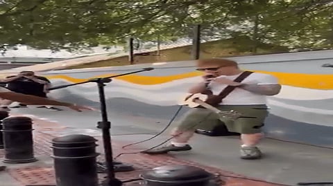 Bengaluru Police confront British musician Ed Sheeran during a busking session on Church Street, Sunday, Feb. 9, 2025.