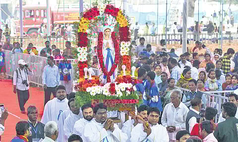 Bishop Thelagathoti Joseph Raja Rao and other clergy members of Gunadala shrine carrying Mother Mary’s idol into the prayer arena in Vijayawada