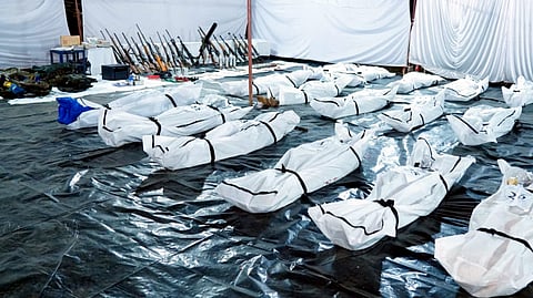 Bodies and captured arms kept after an encounter, in Bijapur, Sunday, Feb. 9, 2025. Two security personnel and 31 Maoists were killed in an encounter in forests under the National Park area of Chhattisgarh's Bijapur district.