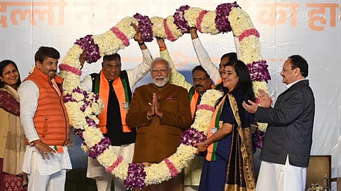 Delhi BJP MPs felicitate Prime Minister Narendra Modi at the BJP headquarters as he joins the party's victory celebration in New Delhi on Saturday.