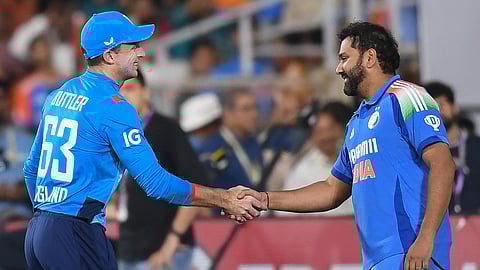 England's captain Jos Buttler (L) shakes hands with his India's counterpart Rohit Sharma at the end of the first ODI cricket match between India and England at the Vidarbha Cricket Association Stadium in Nagpur on February 6, 2025.