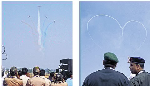 Surya Kiran Aerobatics Team performs on Day 1 of Aero India 2025 at the Yelahanka Air Force Station in Bengaluru on Monday