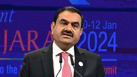 In this photo from Jan. 10, 2024, billionaire Gautam Adani addresses a gathering during the inaugural session of Vibrant Gujarat Global Summit 2024 in Gandhinagar.