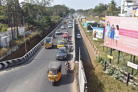 Vehicles moving in slow phase on the 50 year old Uppilipalayam Flyover road from the Syrian Church in Coimbatore on Tuesday.