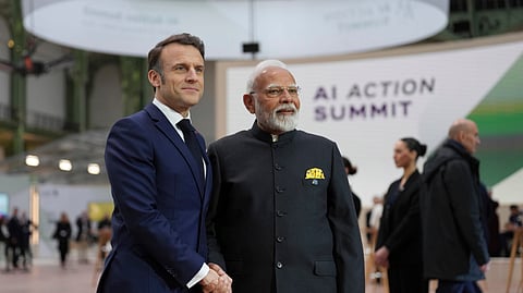 French President Emmanuel Macron poses with India's Prime Minister Narendra Modi.