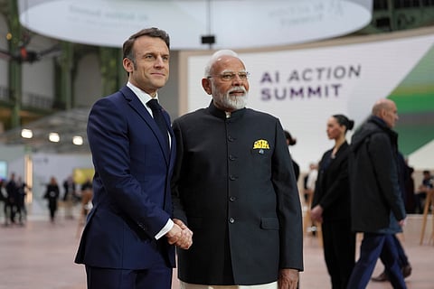 French President Emmanuel Macron poses with India's Prime Minister Narendra Modi at the Grand Palais during the Artificial Intelligence Action Summit in Paris (Photo | AP)