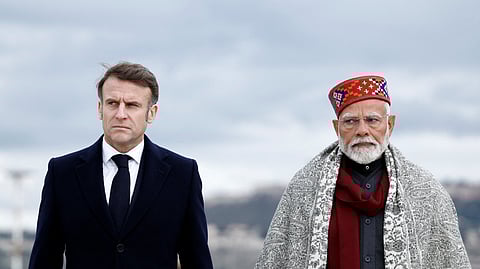French President Emmanuel Macron (L) and Indian Prime Minister Narendra Modi at Marseille Provence airport in Marignane as part of a visit in Marseille, France, February 12, 2025.