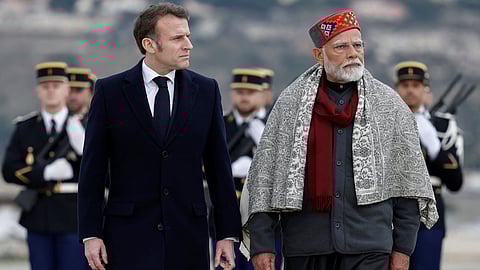 French President Emmanuel Macron, left, and Indian Prime Minister Narendra Modi
