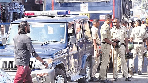 Police personnel keep a watch on Tuesday after a mob attacked a police station in Udayagiri, Mysuru, late on Monday night.