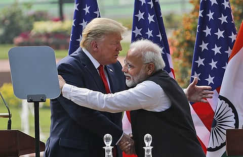 US President Donald Trump and Indian Prime Minister Narendra Modi embrace after giving a joint statement in New Delhi, India, Feb 25, 2020.