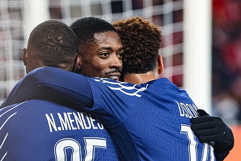 PSG's Ousmane Dembele (C) celebrates with teammates after scoring his team's third goal during the UEFA Champions League knockout phase play-off 1st leg foot on February 11, 2025.