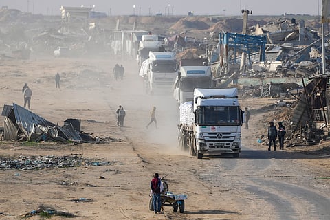 Trucks carrying humanitarian aid enter the Gaza Strip from Egypt in the southern Gaza town of Rafah, Wednesday, Feb. 12, 2025.