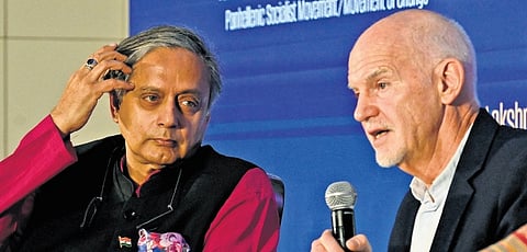 Congress MP Shashi Tharoor listens as former Greek PM George Papandreou speaks during the Global Investors Meet in Bengaluru on Friday