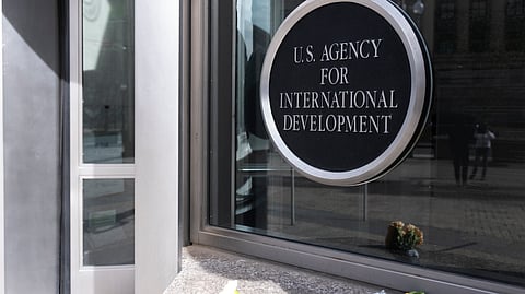 A bouquet of white flowers placed outside the headquarters of the United States Agency for International Development, or USAID, is pictured, Friday, Feb. 7, 2025, in Washington.