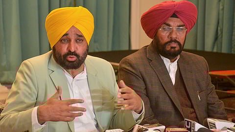 Punjab Chief Minister Bhagwant Mann addresses a press conference over deportation of illegal Indian immigrants from US, in Amritsar, Friday, Feb. 14, 2025.