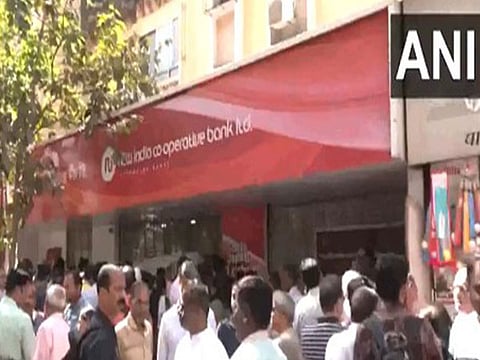 Aggrieved depositors in front of the New India Co-operative Bank, Mumbai.