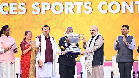 During the closing ceremony of the 38th National Games in Haldwani, Home Minister Amit Shah presents the trophy for Best Performance to the Services team.