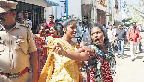 Relatives of the deceased break down in grief as police clear the bodies