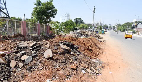 Debris dumped in the space beside the Anna Nagar Uzhavar Sandhai road which was earmarked for setting up Tiruchy’s first food street