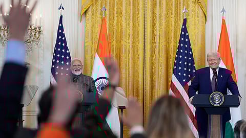 Reporters raise their hands to ask questions during a news conference with US President Donald Trump and Prime Minister Narendra Modi in the East Room of the White House, Thursday, Feb. 13, 2025, in Washington.