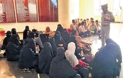 Students and parents of a private school in Thanjavur on Friday waiting for the collector