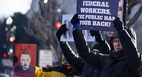 Demonstrators rally in support of federal workers outside of the Department of Health and Human Services, Friday, Feb. 14, 2025, in Washington.