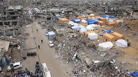 Palestinians take shelter in tents set up amid heavily damaged buildings in Jabalia in the northern Gaza Strip during a truce in the war between Israel and Hamas.