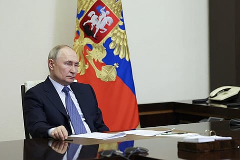 Russian President Vladimir Putin speaks to Governor of Sevastopol Mikhail Razvozhayev during their meeting via videoconference at the Novo-Ogaryovo state residence outside Moscow, Russia, Friday, Feb. 14, 2025.