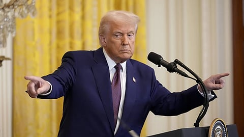 President Donald Trump points to a reporter and India’s Prime Minister Narendra Modi during a news conference in the East Room of the White House, Thursday, Feb. 13, 2025, in Washington.