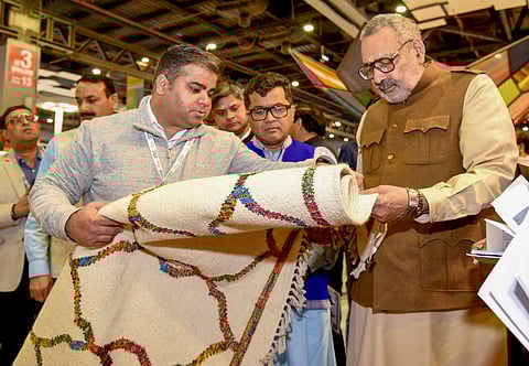 In this image released by PIB on Feb. 14, 2025, Union Minister of Textiles Giriraj Singh and Union Minister of State for External Affairs and Textiles Pabitra Margherita during a visit to Bharat Tex 2025 at the Bharat Mandapam, in New Delhi.
