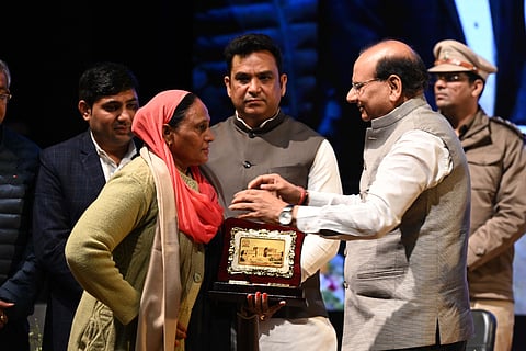 Delhi L-G Vinai Kumar Saxena felicitates MCD sanitation officials during Samvaad at Civic Centre, New Delhi.