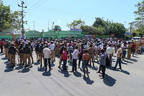 Mechanised vessel trawler fishermen block beach road demanding multi day fishing during demonstration in front of the fishing harbour