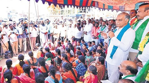 Former minister T Harish Rao takes part in a protest staged by residents against the Pyaranagar dumpyard at Gummadidala Mandal on Friday.