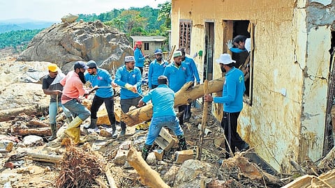 Volunteers conduct mass search operation in a landslide-hit area in Wayanad.
