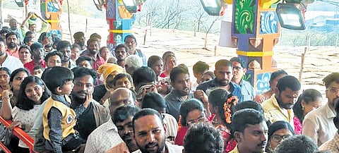 People wait in the queue at Lingamanthulu jatara, Suryapet on Sunday