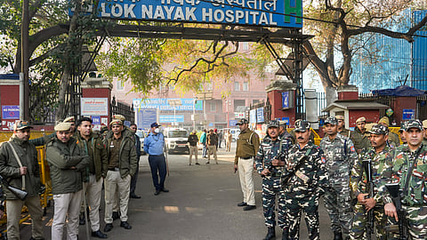 Security personnel stand guard at the Lok Nayak Jai Prakash Hospital, where injured victims of the New Delhi Railway Station stampede are admitted, in New Delhi, Sunday, Feb. 16, 2025.