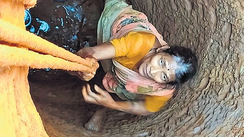 Gowri works on her 40-foot-deep well in Sirsi, Uttara Kannada