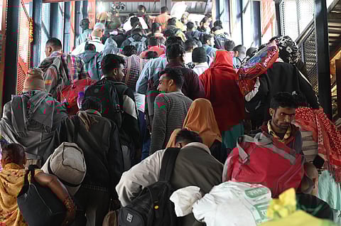 Passengers in a large number at the New Delhi railway station, Sunday, Feb. 16, 2025.