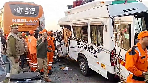 Police and State Disaster Response Force (SDRF) personnel conduct the rescue operation after a tempo traveller collided with a bus on Purvanchal Expressway, in Barabanki on Sunday