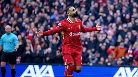 Liverpool's Mohamed Salah celebrates after scoring his side' second goal during the EPL soccer match between Liverpool and Wolverhampton Wanderers at Anfield Stadium in Liverpool, Sunday, Feb. 16, 2025.