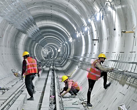 Metro workers at the MG Road Underground Metro Station in Bengaluru on Monday. The UG corridor with a length of 13.75 km connects Dairy Circle in the South with Nagawara in North Bengaluru