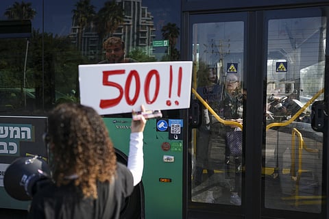 Relatives and supporters of Israelis held hostage in the Gaza Strip, block a freeway during a protest demanding their release from Hamas captivity as they mark 500 days of the Israel-Hamas war in Tel Aviv, Israel, Monday, Feb 17, 2025.