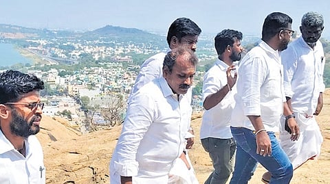 Minister L Murugan visiting the hill temple on Monday